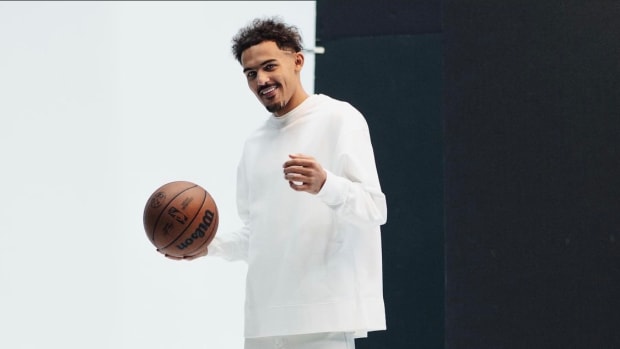 Trae Young wearing black and white shoes.